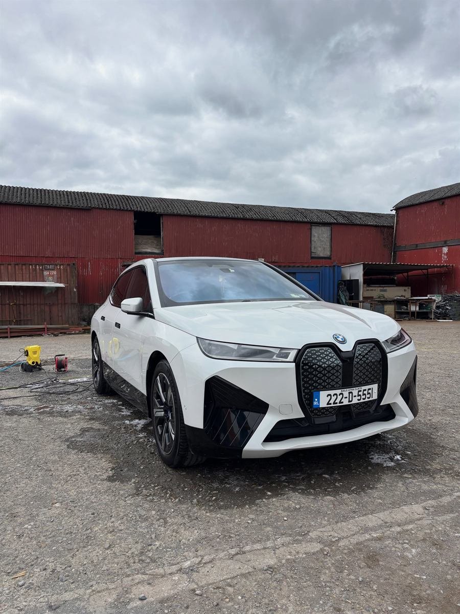 White BMW iX after a valet