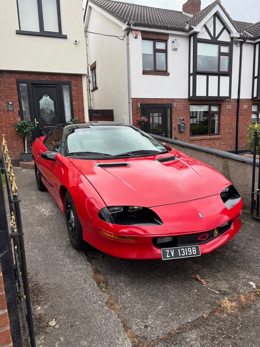 Red Chevrolet Camaro after a valet